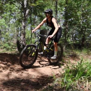 Cyclist riding a mountain bike on a forest trail